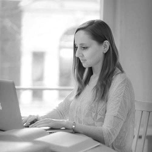 Portrait of Vicky Hampton working on a laptop